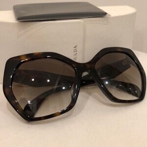 Authentic pre owned Prada oval sunglasses
